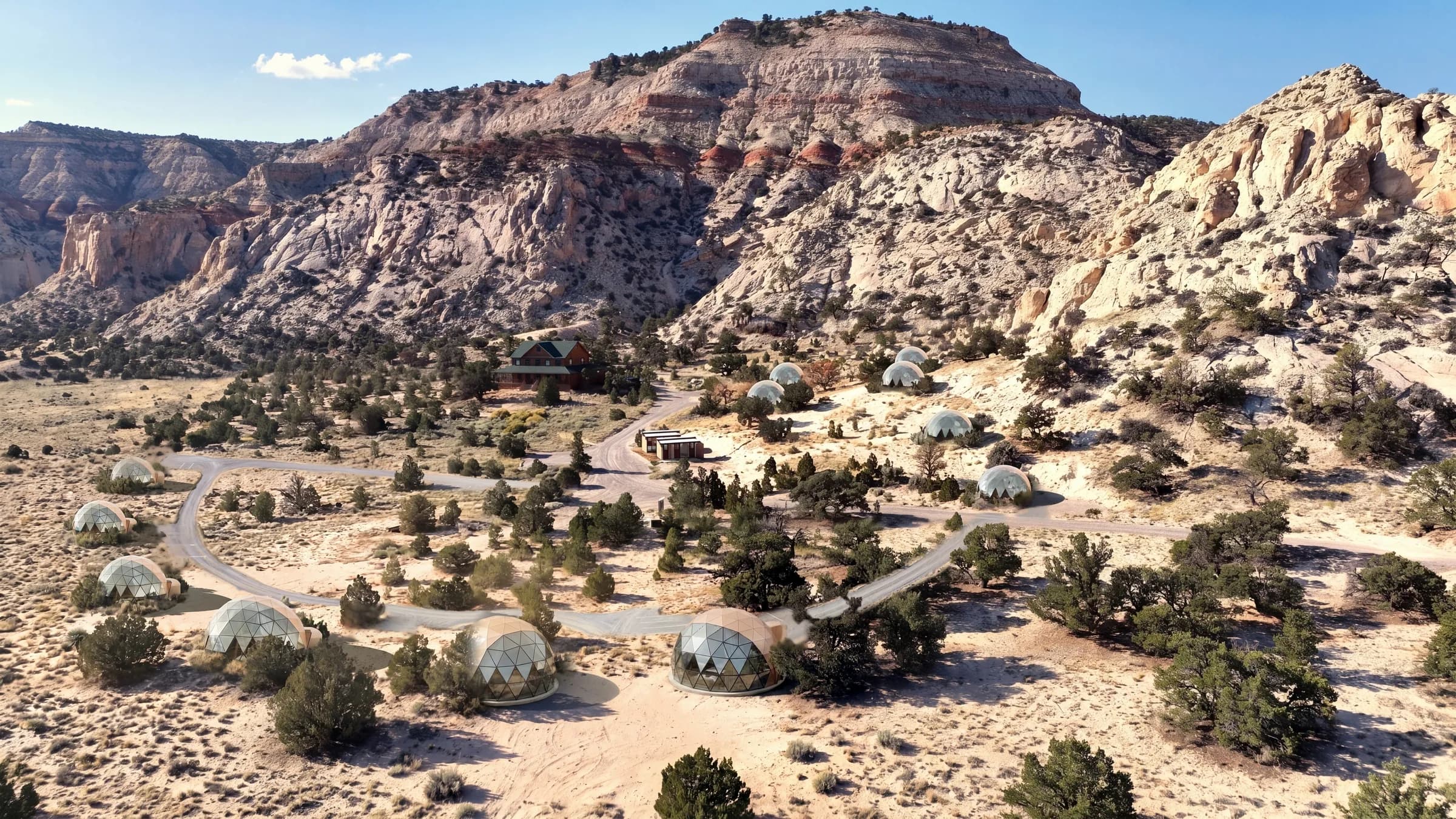 Visualisation of the planned full build-out: twelve glass geodesic domes and a new loop road below sandstone cliffs near Capitol Reef National Park